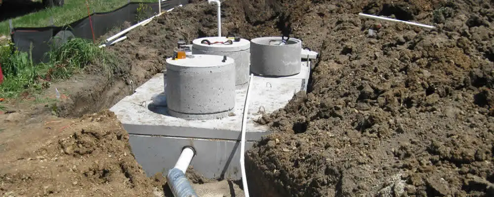 Septic system repair and installation site with tank access ports in Atlanta, GA