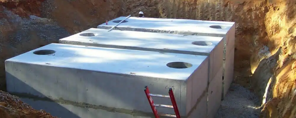 Septic tank installation site with a newly placed concrete tank in Atlanta, GA